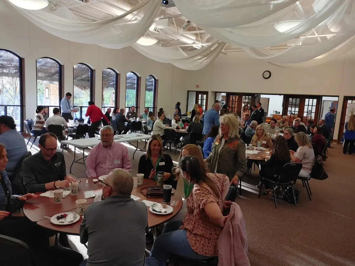 A full room of guests at a catered event